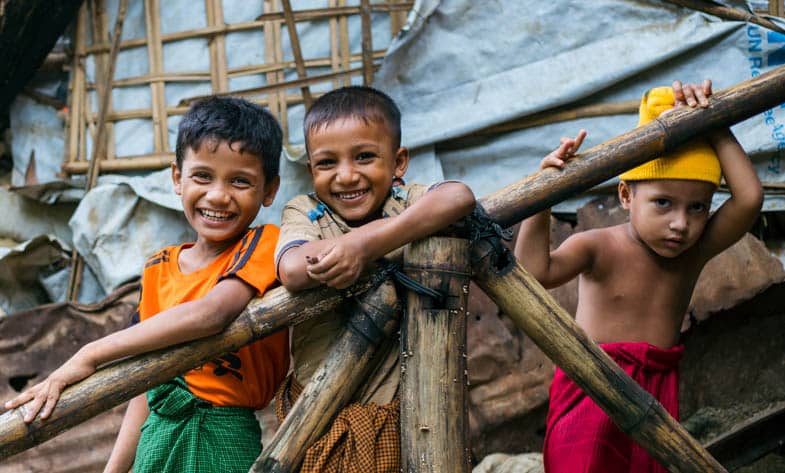 Children lean on a stair rail in Kutupalong Refugee Camp, Bangladesh.
