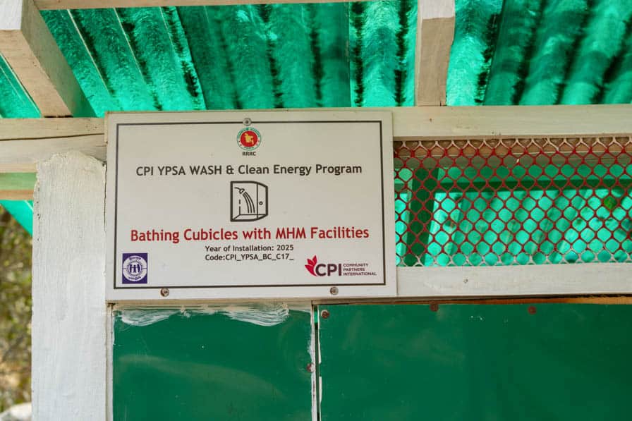 A sign on a bathing cubicle block in Kutupalong Refugee Camp, Bangladesh, advertising menstrual hygiene management facilities.
