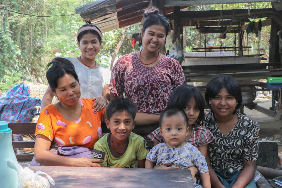 Daw Khin Zaw Win and her children outside their home in Amarapura, Myanmar.