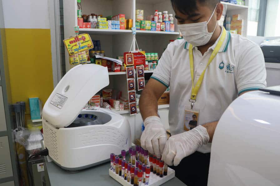 A health worker tests blood samples at the Nae Thit Kyan Mar clinic in Amarapura, Myanmar.