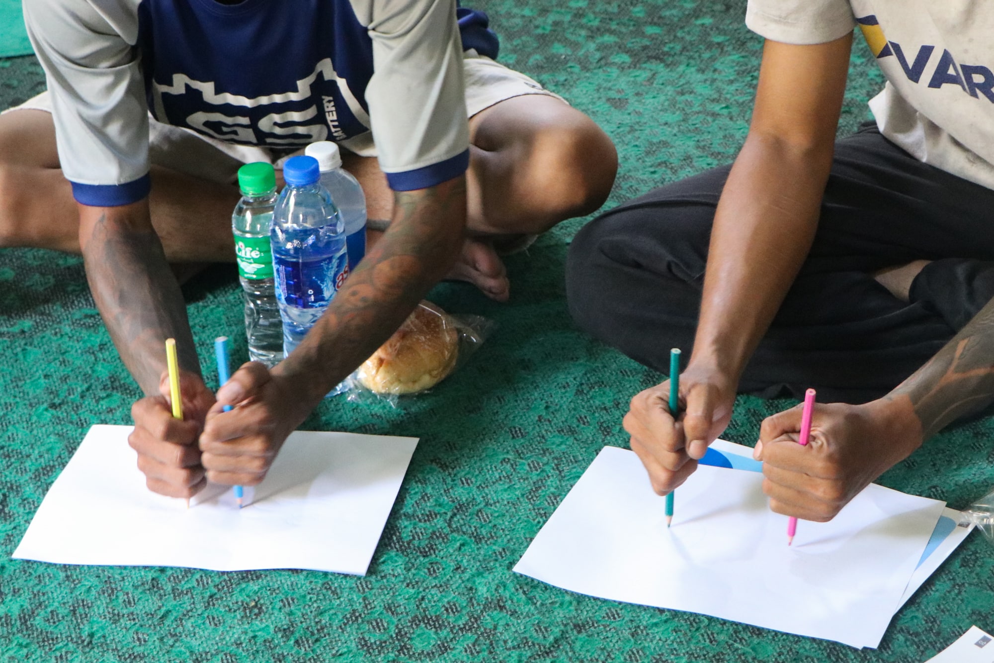 Deaf survivors of the March 2025 earthquake do a drawing activity during a mental health counseling session in Mandalay, Myanmar.